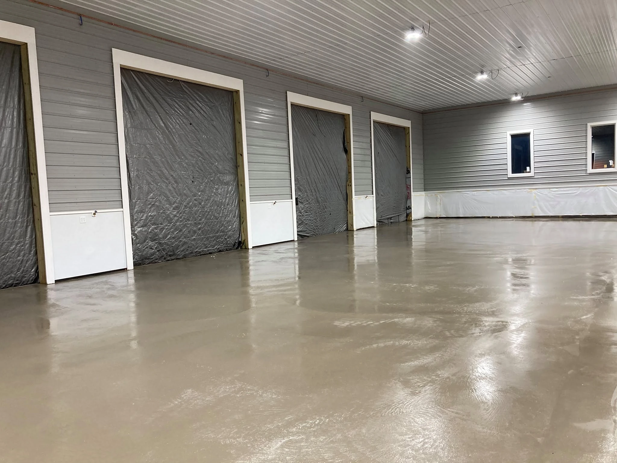 Concrete floor & overhead-door bays